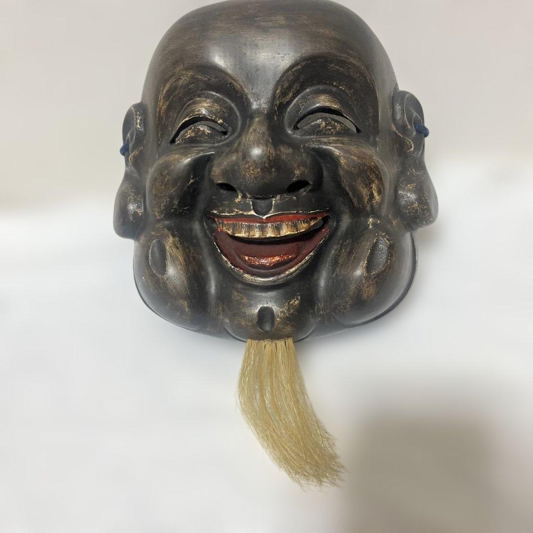 木製の笑顔の能面，大黒